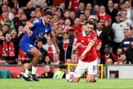 Wesley Fofana (C) vies for possession with Bruno Fernandes (R)